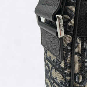 DIOR | #DIORESSENTIALS Clutch with shoulder strap
